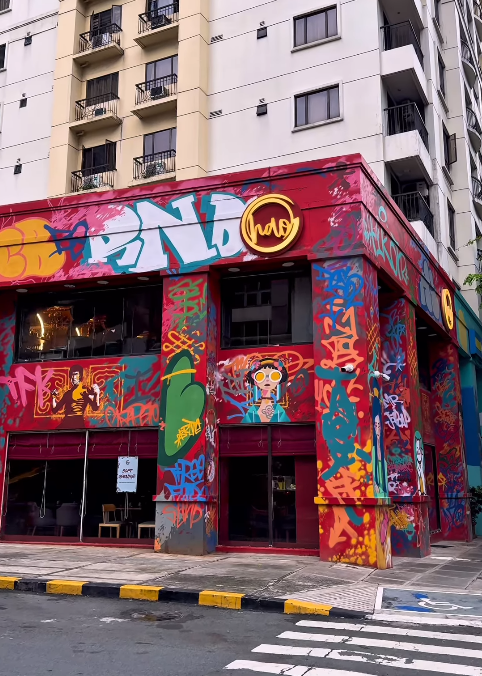 hăo exterior street view showing the bold red facade in BGC